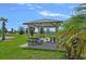 Shaded picnic area with tables and seating, perfect for outdoor gatherings and relaxation at 232 Summerlin Loop, Haines City, FL 33844