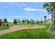 Community playground with various climbing structures and play equipment for children at 232 Summerlin Loop, Haines City, FL 33844