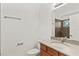 Bathroom featuring a vanity, toilet, mirror, and walk-in shower at 232 Windflower Way, Oviedo, FL 32765