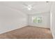 This bedroom features neutral carpet and two windows that provide ample natural light at 232 Windflower Way, Oviedo, FL 32765