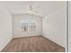 This bedroom features neutral carpet and two windows for ample natural light at 232 Windflower Way, Oviedo, FL 32765