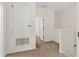 Upstairs hallway featuring carpet floors, an access panel and a storage closet at 232 Windflower Way, Oviedo, FL 32765