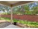 This patio offers outdoor living space and shade trees at 232 Windflower Way, Oviedo, FL 32765