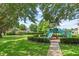 A playground is nestled in a lush green space, perfect for children to play at 232 Windflower Way, Oviedo, FL 32765