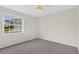 The bedroom has neutral walls and carpet, plus a window at 2404 Sw 20Th Ter, Ocala, FL 34471