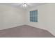 Bright, neutral bedroom features a ceiling fan and window at 2404 Sw 20Th Ter, Ocala, FL 34471