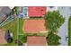Overhead view of a home with a fenced backyard and a vibrant, tiled roof at 2422 Condado Ct, Kissimmee, FL 34743