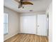 Bedroom featuring a hardwood floor, a ceiling fan, and a closet at 2422 Condado Ct, Kissimmee, FL 34743