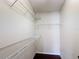 The closet features white walls, dark floors and wire shelves at 2422 Condado Ct, Kissimmee, FL 34743