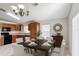 Open concept dining room featuring stylish furnishings and bright natural light at 2422 Condado Ct, Kissimmee, FL 34743