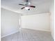 Spacious living room featuring neutral-toned tile flooring and ample natural light at 2422 Condado Ct, Kissimmee, FL 34743