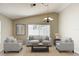 Cozy living room featuring neutral colors, a vaulted ceiling, and a sliding glass door at 2422 Condado Ct, Kissimmee, FL 34743