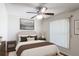 Relaxing bedroom featuring a ceiling fan, a neutral color palette, and a plush queen-size bed at 2422 Condado Ct, Kissimmee, FL 34743