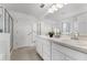 Bathroom with double vanity, walk-in shower, and ample cabinet space at 2432 Riviera Ln, Minneola, FL 34715