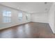 Bright, expansive room with hardwood floors, recessed lighting, and multiple windows for natural light at 2432 Riviera Ln, Minneola, FL 34715