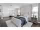 Spacious main bedroom with sitting area, windows, and plush carpeting at 2432 Riviera Ln, Minneola, FL 34715