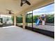 Large screened in patio area overlooking backyard with play structure and mature landscaping at 2432 Riviera Ln, Minneola, FL 34715