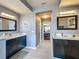 Bathroom showcasing dual vanities with dark wood cabinets, quartz countertops, and modern lighting fixtures at 2558 Ballard Ave, Orlando, FL 32833