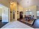 Elegant dining room boasts a chandelier, dark wood floors, and access to the backyard at 2558 Ballard Ave, Orlando, FL 32833