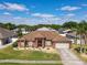 Lovely home with a well-manicured lawn, mature trees and long driveway at 2558 Ballard Ave, Orlando, FL 32833