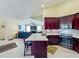 Bright kitchen features a large island, stainless steel appliances, and opens to the living area, perfect for entertaining at 2558 Ballard Ave, Orlando, FL 32833