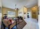 Comfortable living room with dark floors, large windows, and light yellow paint at 2558 Ballard Ave, Orlando, FL 32833