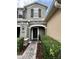 Charming home entrance featuring a stone-accented facade, elegant door, and manicured landscaping at 2564 River Landing Dr, Sanford, FL 32771
