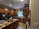 Bright kitchen with stainless steel appliances, granite countertops, and ample cabinet space at 2564 River Landing Dr, Sanford, FL 32771