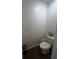 Toilet room with basic toilet and dark floor at 2564 River Landing Dr, Sanford, FL 32771