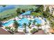 Aerial view of community pool with palm trees, splash park, and sun loungers at 2616 Bowring St, Kissimmee, FL 34747