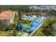 Aerial view of the community pool, splash park, lake, and lounging areas at 2616 Bowring St, Kissimmee, FL 34747