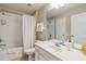 Functional bathroom with a single sink vanity, and shower-tub combo, for everyday convenience at 2616 Bowring St, Kissimmee, FL 34747