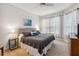 Relaxing bedroom with a queen bed and neutral tones, offering a peaceful retreat at 2616 Bowring St, Kissimmee, FL 34747