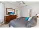 Cozy bedroom features a queen bed, dresser and ample natural light at 2616 Bowring St, Kissimmee, FL 34747