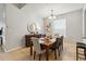 Inviting dining room featuring a wooden table with seating for six and a decorative buffet at 2616 Bowring St, Kissimmee, FL 34747