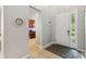Bright foyer features tile flooring, a charming entry mat, and a view into the kitchen space at 2616 Bowring St, Kissimmee, FL 34747