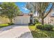 Charming two-story home featuring a two-car garage, well-maintained landscaping and a lovely tiled roof at 2616 Bowring St, Kissimmee, FL 34747