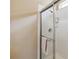 Shower with white tile, glass door and stainless steel hardware at 2616 Bowring St, Kissimmee, FL 34747