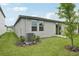 Image of a backyard with an AC unit, and sliding glass doors at 2778 Virginia Pine Dr, Bartow, FL 33830