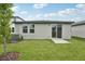 Image of a backyard with an AC unit and a covered back patio at 2778 Virginia Pine Dr, Bartow, FL 33830
