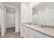 Bathroom with dual vanities, granite counters, tile flooring, and modern fixtures at 2778 Virginia Pine Dr, Bartow, FL 33830