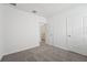 Bedroom featuring neutral carpet and doorway leading to bathroom at 2778 Virginia Pine Dr, Bartow, FL 33830