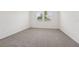 Cozy carpeted bedroom with two windows offering natural light and neutral decor at 2778 Virginia Pine Dr, Bartow, FL 33830