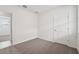 Light-filled bedroom featuring neutral carpet and an open doorway at 2778 Virginia Pine Dr, Bartow, FL 33830