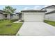 Charming single-story home with a two-car garage and a well-manicured lawn at 2778 Virginia Pine Dr, Bartow, FL 33830