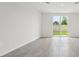 Bright living room featuring tiled floors and sliding glass doors leading to the backyard at 2778 Virginia Pine Dr, Bartow, FL 33830