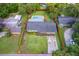 Sprawling backyard with a sparkling pool and lush landscaping at 2809 Sanbina St, Winter Park, FL 32789