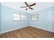 This bedroom offers hard surface floors, two windows, and a ceiling fan at 2809 Sanbina St, Winter Park, FL 32789