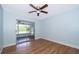 This bedroom offers hard surface floors and a large closet with views of the pool at 2809 Sanbina St, Winter Park, FL 32789