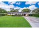 Charming single-story home with a well-maintained lawn and covered carport in a desirable neighborhood at 2809 Sanbina St, Winter Park, FL 32789
